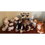 A selection of china cats various makers and ages including Royal Worcester, Royal Doulton etc