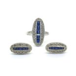 An oval shaped ring with a central row of step cut sapphires, earrings to match. Weights are