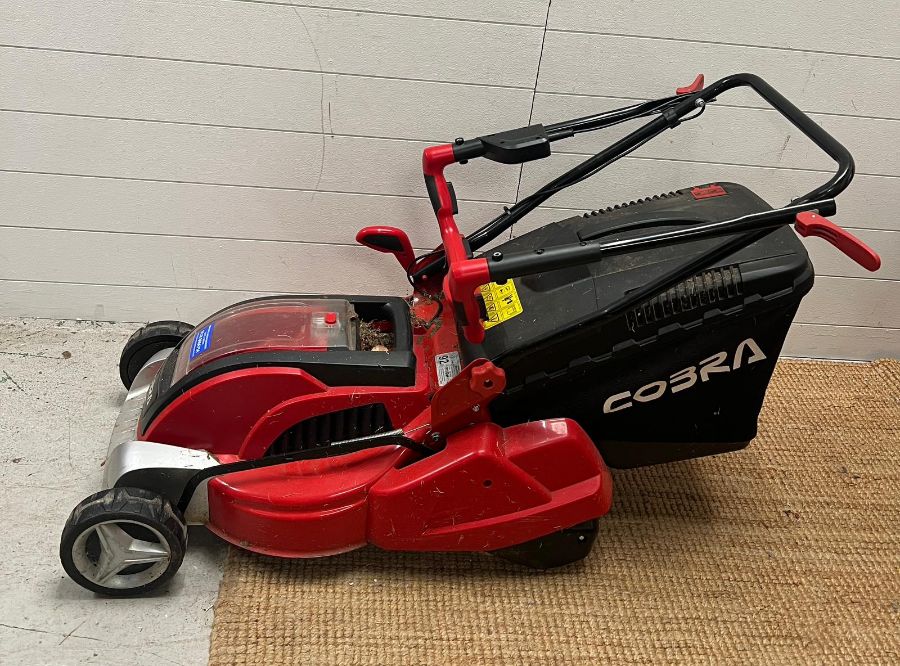 A Cobra cordless lawn mower