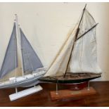 Two racing yachts on stands, blue and white sails (40cm x 55cm)