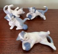 Four miniature cats stamped to base