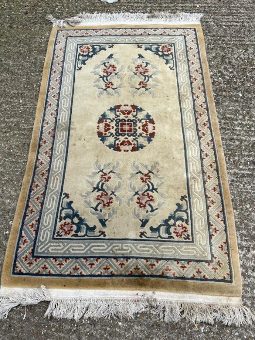 A cream ground rug