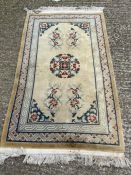 A cream ground rug