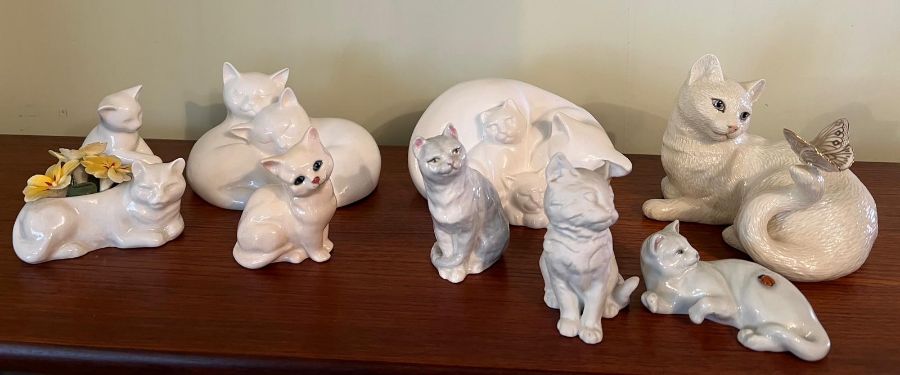 A selection of porcelain cats various makers including Royal Doulton, Crown and Royal Worcester