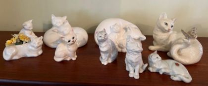 A selection of porcelain cats various makers including Royal Doulton, Crown and Royal Worcester