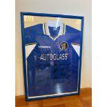 A framed Chelsea FC shirt with signatures including Robert Di Matteo, Gus Poyet and Graham Leseaux