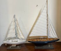 Two racing yachts on stands