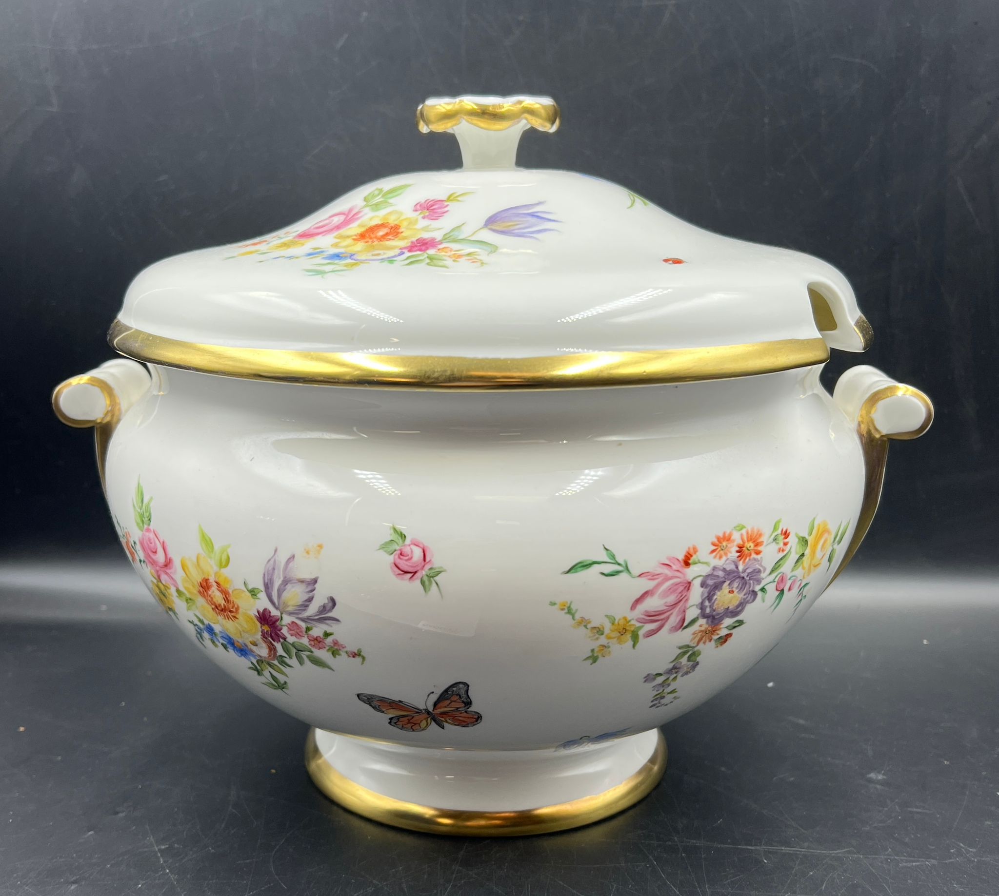 A hand painted porcelain soup tureen