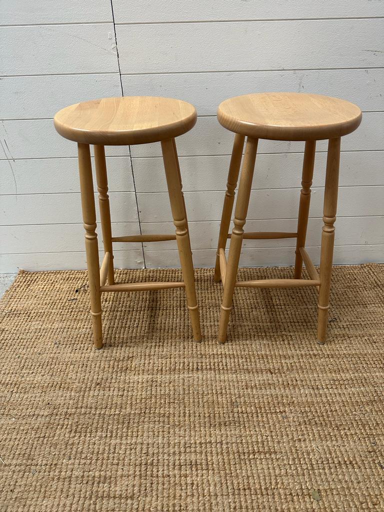 A pair of pine bar stools (Height 68cm)