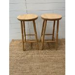 A pair of pine bar stools (Height 68cm)