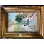 A cottage print in a gilt frame