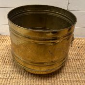 A brass plant bucket with lion head handles (base AF) (H27cm Dia31cm)
