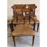 A set of five mahogany Edwardian dining chairs upholstered in gold