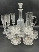 A selection of cut glass decanters, water jugs and stemmed bowls