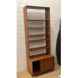 A G-Plan bookcase with four shelves and cupboard under (H98cm W76cm D48cm)