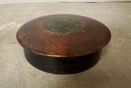 A small lidded mahogany trinket box with green inlay