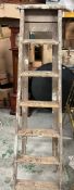 A vintage wooden step ladder
