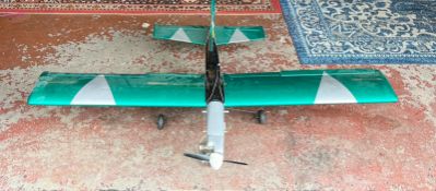 A green, black and silver aircraft model