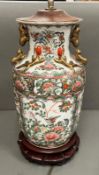 A Chinese Canton Famille Rose vase, decorated floral and foliate scroll ground, converted to a lamp