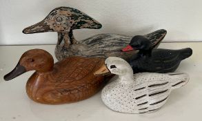 A selection of four wooden carved ducks