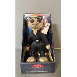 A boxed Yakovs compare the meerkat toy