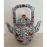 A double sided Chinese teapot with tree peonies decoration.