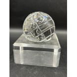 A Waterford crystal globe on an acrylic stand