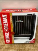 A George Foreman grill, boxed.