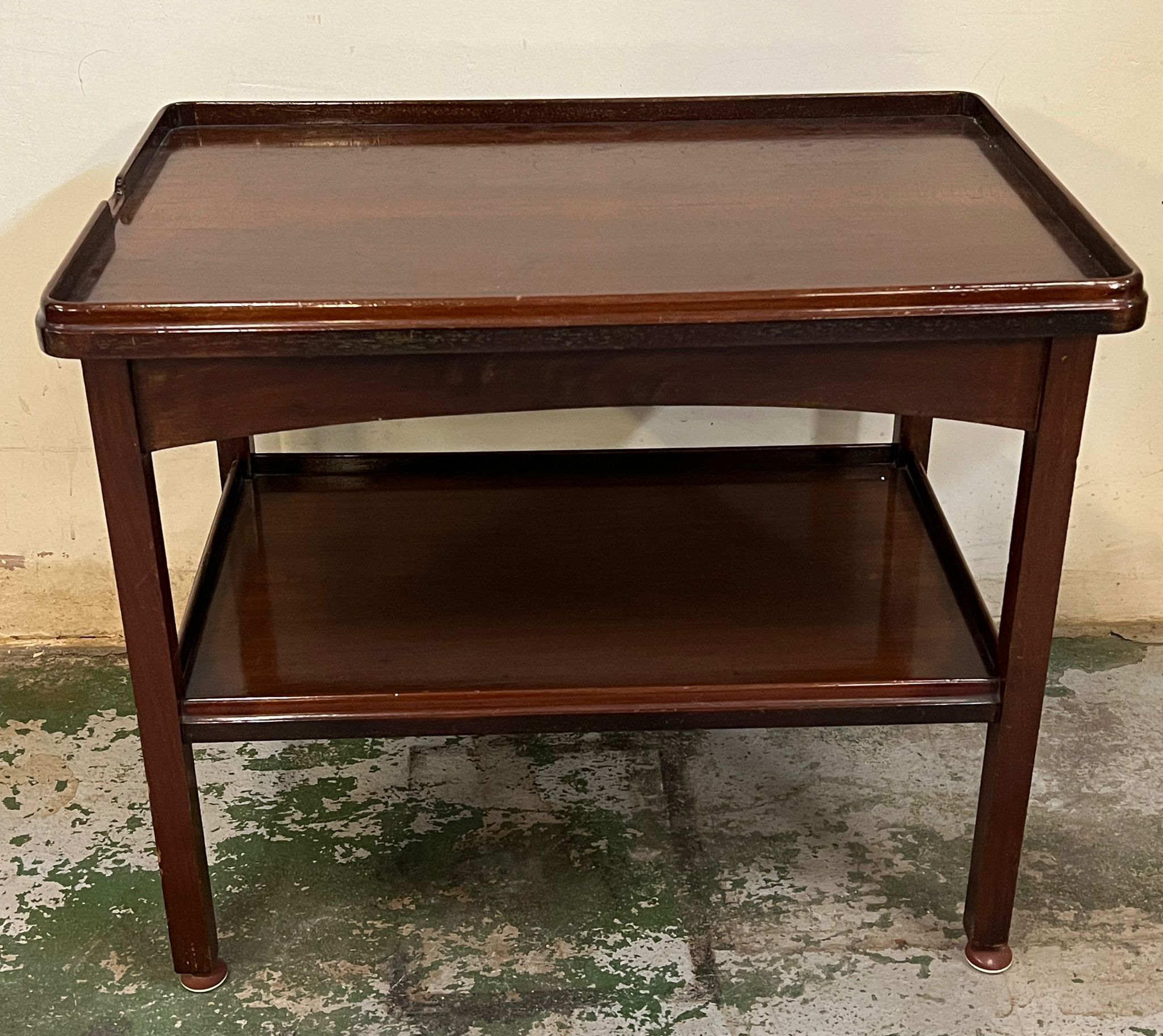 A two tier mahogany side table (H64cm W77cm D50cm)