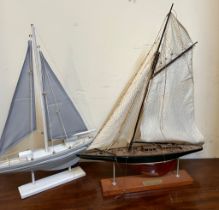 Two racing yachts on stands, blue and white sails (40cm x 55cm)