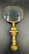 A Brass handled magnifying glass