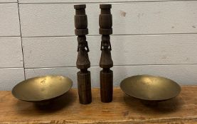 Two carved wooden African candle sticks and two brass bowls