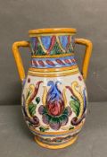 A Studio Pottery two handled vase with floral decoration