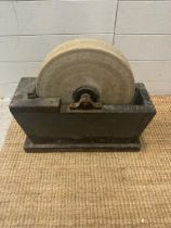 A vintage wet grinding stone grinder