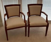A pair of cherry wood style side chairs