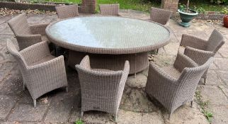 An Ocean garden rattan dining table and eight chairs