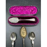 A selection of four silver spoons, one in a case, various makers and hallmarks.
