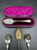 A selection of four silver spoons, one in a case, various makers and hallmarks.