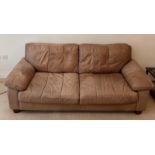 A three seater leather sofa (H78cm W208cm D92cm)