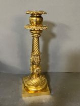 A brass candlestick on square base and twisted form (37cm H )