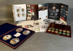 A selection of collectable coin packs some complete and some part packs