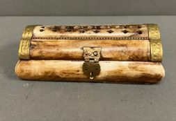 A Bone carved trinket or jewellery box with brass fittings