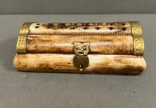A Bone carved trinket or jewellery box with brass fittings