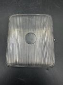 A silver cigarette case, hallmarked, by S& C Ltd