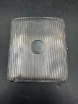 A silver cigarette case, hallmarked, by S& C Ltd