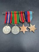 Militaria: A WWII Medal Bar to include War Medal, Defence Medal, The Burma Star and 1939-45 Star.