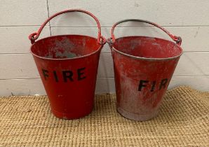 Two vintage red fire buckets