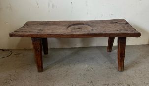 A rustic oak coffee table on splayed legs (H39cm W113cm D48cm)
