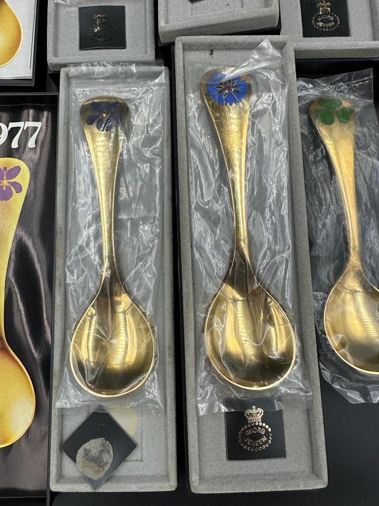 Georg Jensen, seven modern Danish silver-gilt and enamel year spoons,1972, 1974-79 the terminals - Image 3 of 3