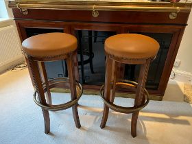 Two bar stools with brass foot rests